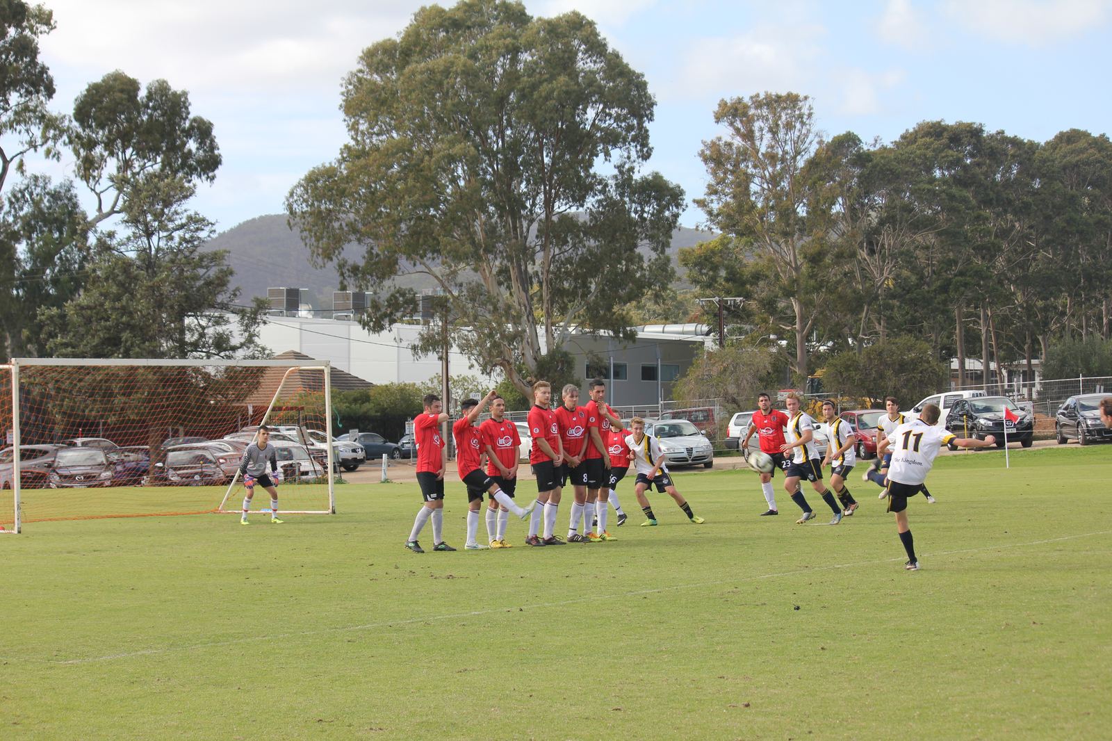 Zak strikes the ball as the wall jumps