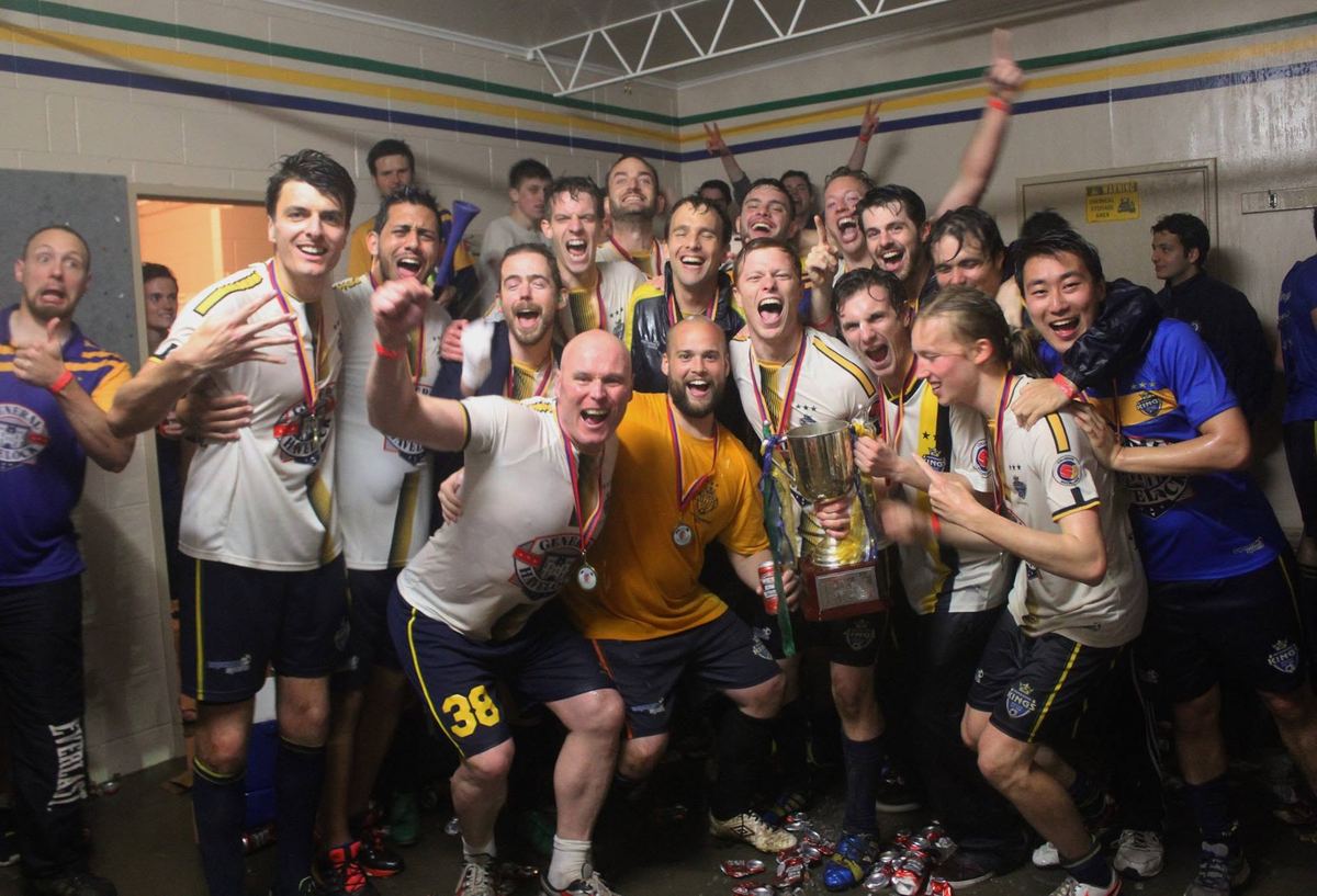 Bs team celebrating a championship win in the change rooms