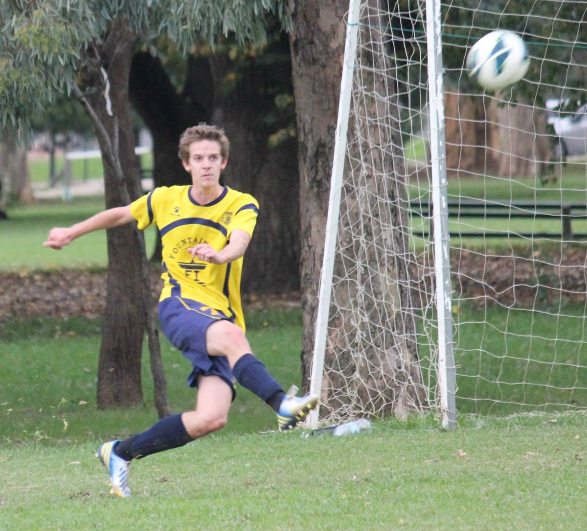 Zak clearing the ball near goal