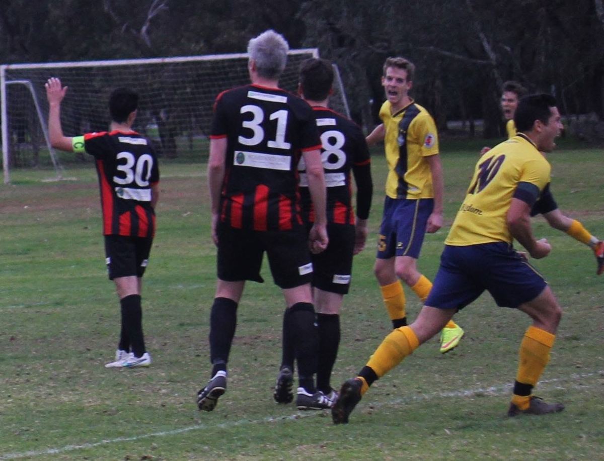 Match action against a team in red and black stripes